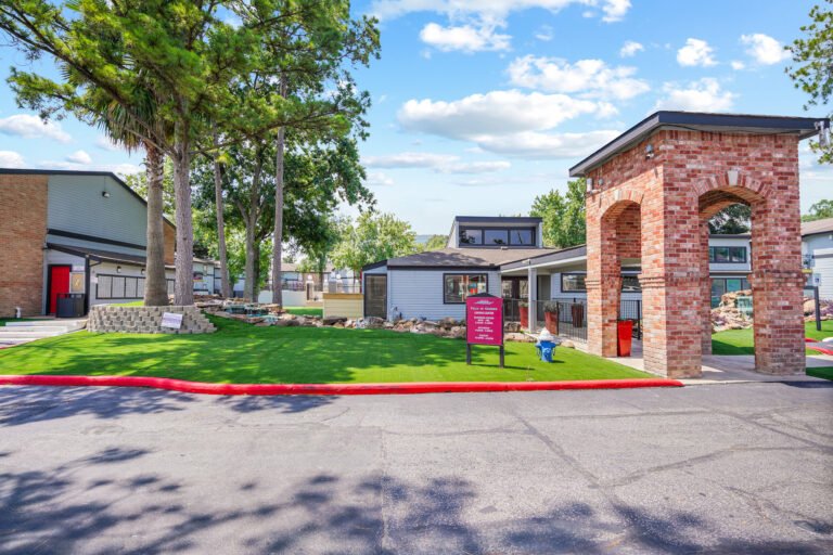 Exterior view of the leasing office at Falls of Gessner, affordable luxury apartments in Houston, TX.